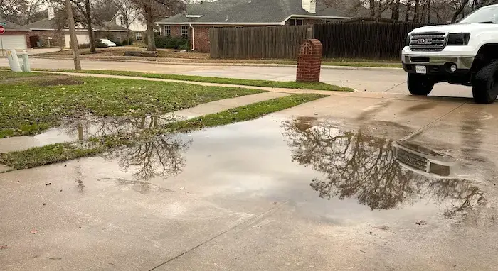 Sinking driveway causing water to pool